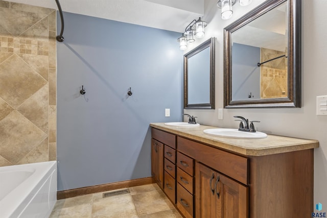 bathroom featuring double vanity, a bathtub, a shower, and baseboards