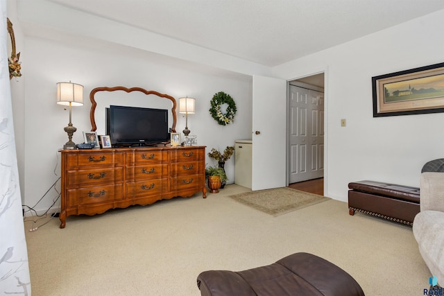 living area featuring carpet