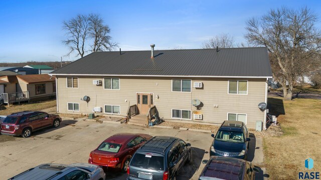 301 W Prospect Ave, Flandreau, SD 57028 - rear view of property featuring uncovered parking and metal roof
