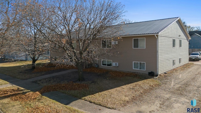 301 W Prospect Ave, Flandreau, SD 57028 - view of home's exterior with metal roof and a wall mounted AC