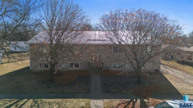 301 W Prospect Ave, Flandreau, SD 57028 - split foyer home with metal roof and a front yard
