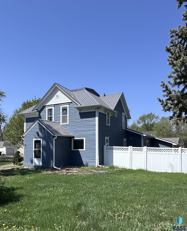 view of home's exterior featuring metal roof and a standing seam roof
