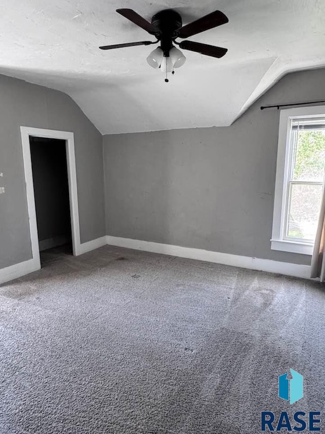 bonus room featuring vaulted ceiling, a ceiling fan, carpet, and baseboards