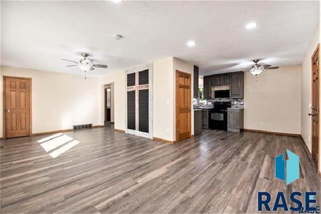 unfurnished living room with a ceiling fan, baseboards, wood finished floors, and recessed lighting