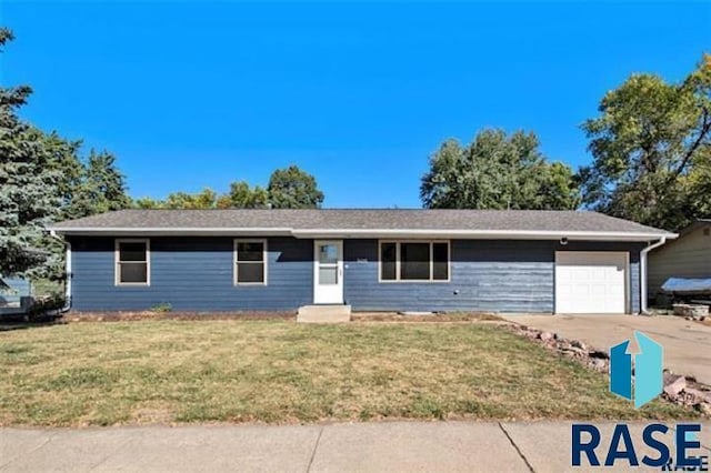 ranch-style house with driveway, a garage, and a front yard