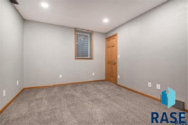 carpeted empty room with baseboards and recessed lighting