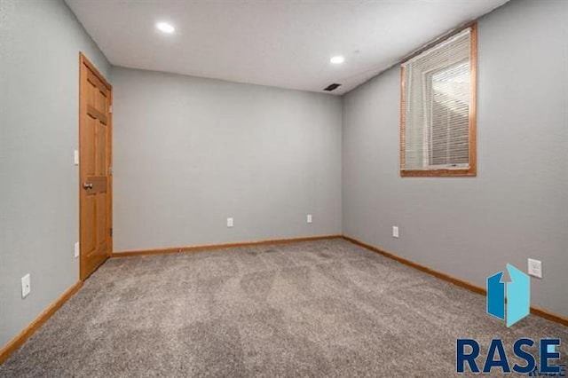 carpeted spare room with baseboards and recessed lighting