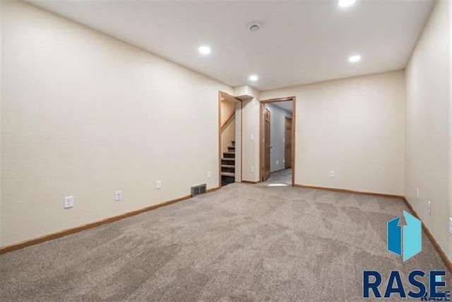 finished basement featuring recessed lighting, stairway, carpet floors, and baseboards