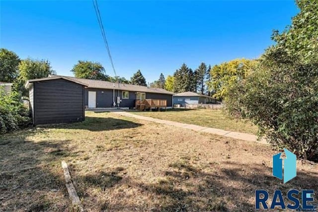 back of property with a yard
