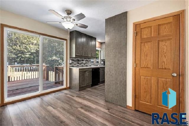 kitchen featuring dishwasher, wood finished floors, ceiling fan, and healthy amount of natural light