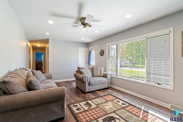 living room featuring baseboards, ceiling fan, wood finished floors, and recessed lighting