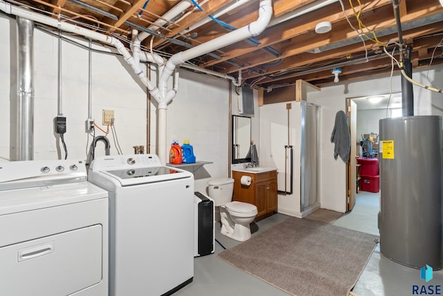 clothes washing area with washing machine and clothes dryer and water heater