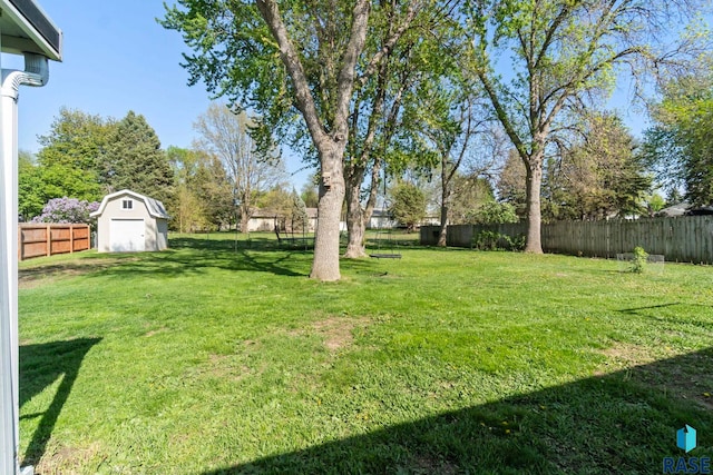 view of yard with a shed and an outdoor structure