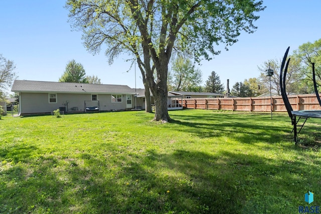 view of yard with a trampoline
