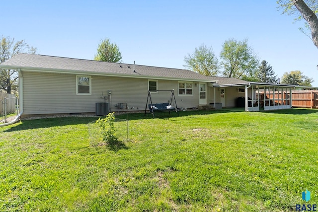 back of house featuring a sunroom and cooling unit