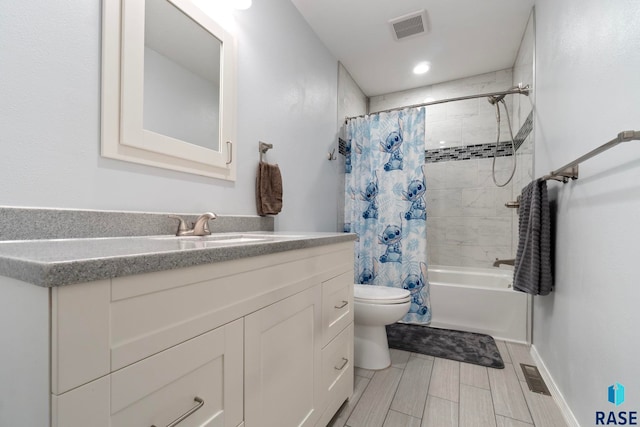 bathroom with toilet, vanity, and shower / tub combo with curtain