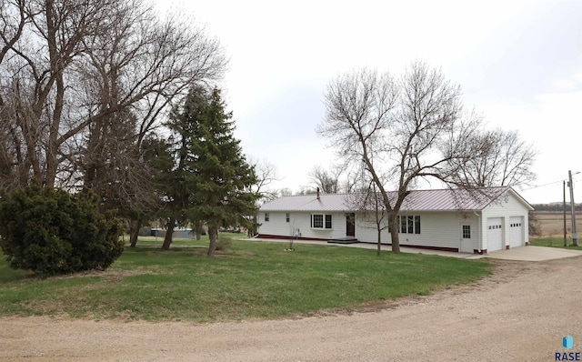 47743 233a St, Egan, SD 57024 - single story home featuring concrete driveway, a garage, a front yard, and metal roof
