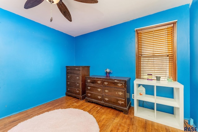 bedroom featuring wood finished floors and a ceiling fan