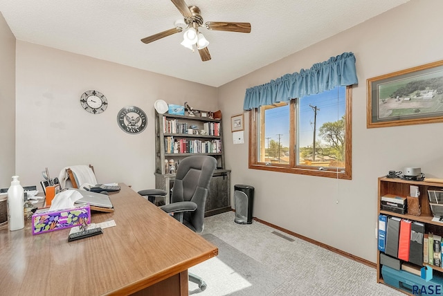 home office with ceiling fan, carpet floors, and baseboards