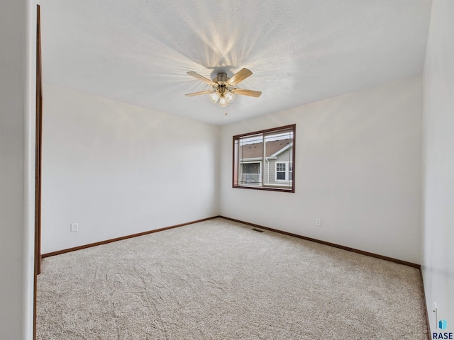 1180 Ruud Trl, Hartford, SD 57033 - carpeted spare room featuring a ceiling fan and baseboards