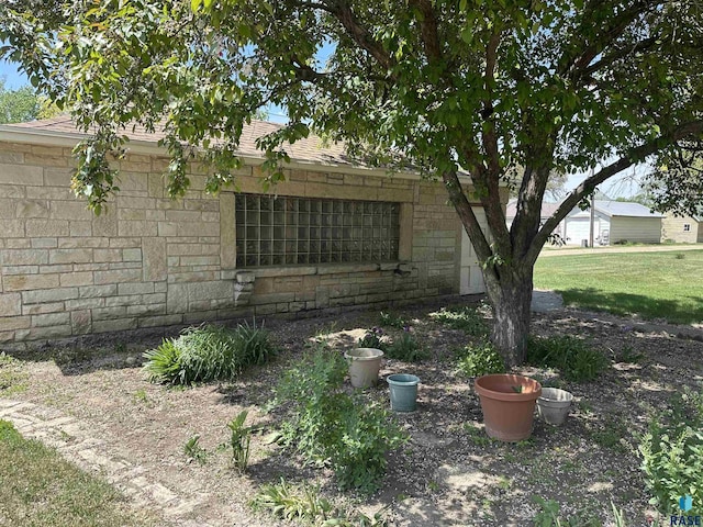 view of side of property featuring stone siding