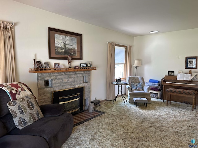 living room featuring a stone fireplace, carpet floors, and baseboards