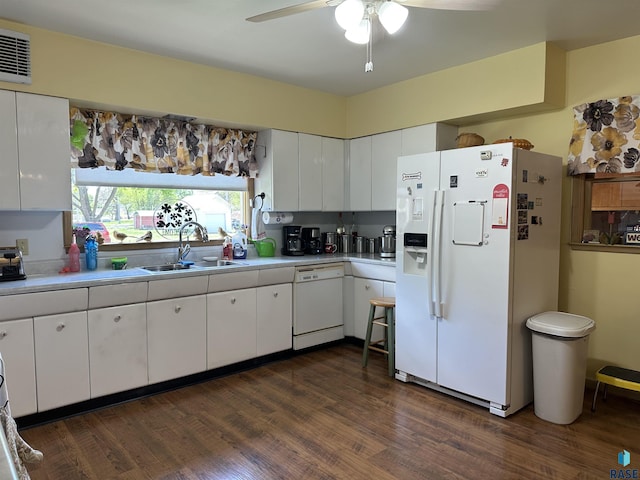 kitchen featuring white appliances, a sink, light countertops, and ceiling fan