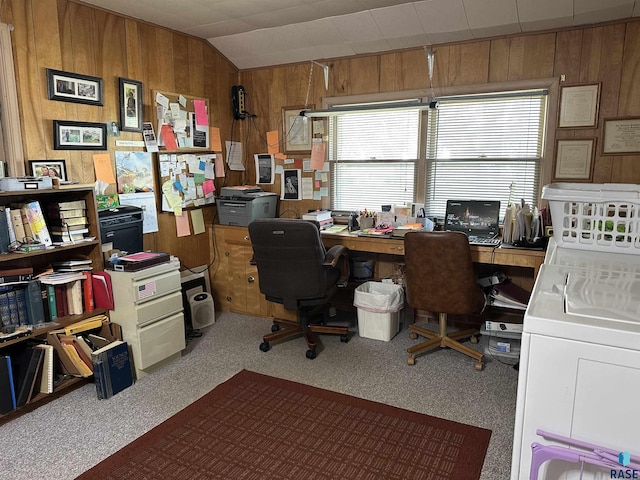 office area with wood walls, washer / dryer, carpet floors, and vaulted ceiling