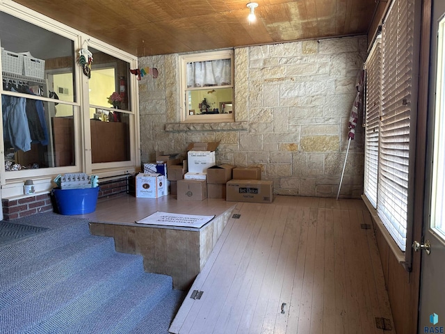 interior space featuring hardwood / wood-style floors and wood ceiling