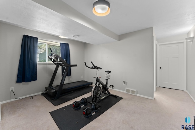 workout room featuring carpet flooring and baseboards