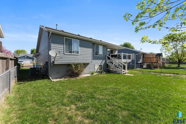back of house featuring stairway and a deck