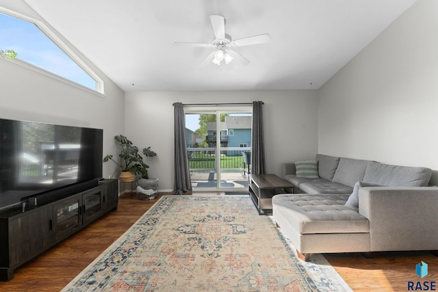 living room with dark wood finished floors, ceiling fan, and lofted ceiling