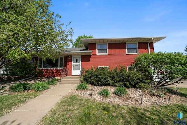 tri-level home featuring board and batten siding