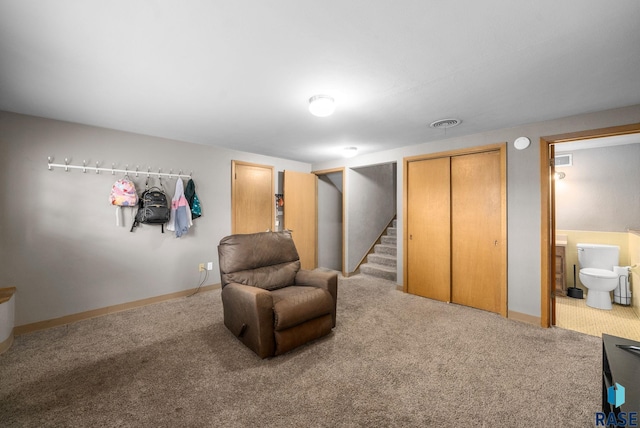living area featuring carpet, stairway, and baseboards
