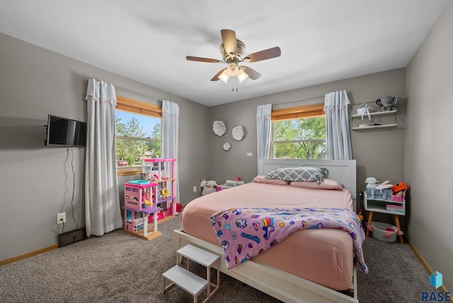 bedroom with multiple windows, carpet floors, and ceiling fan