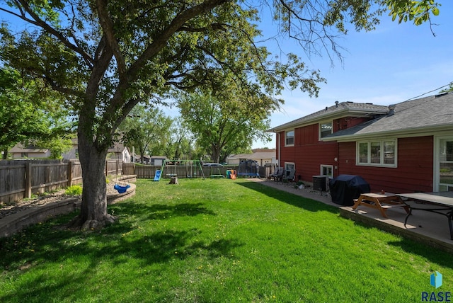view of yard featuring a trampoline