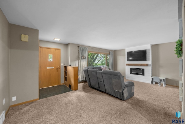 carpeted living room with a fireplace and baseboards