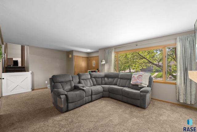 living room with carpet and baseboards