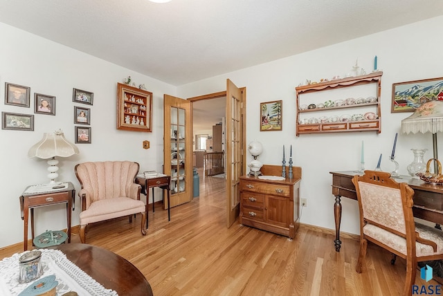 living area with light wood-style floors