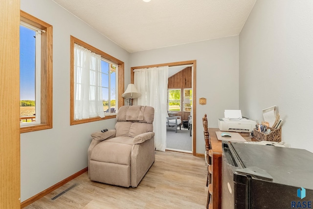 sitting room featuring light wood-style floors and baseboards