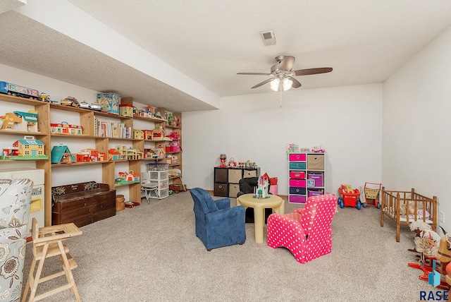 game room featuring carpet flooring and a ceiling fan
