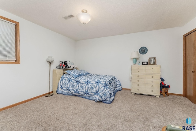 bedroom featuring carpet floors and baseboards