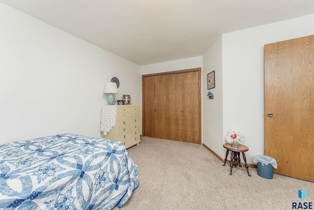 bedroom with carpet floors and a closet