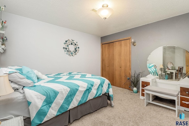 bedroom with carpet floors, a closet, a textured ceiling, and arched walkways