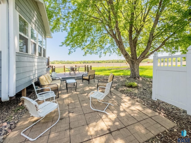 view of patio featuring fence