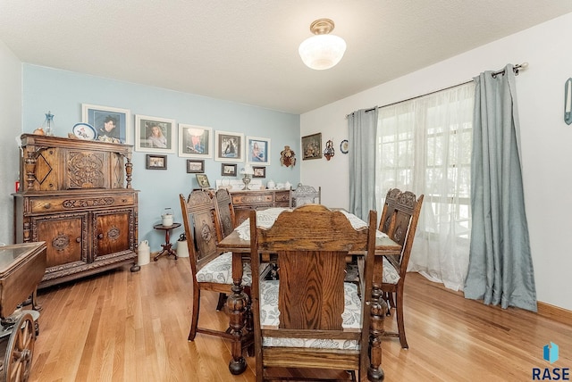 dining room with light wood-style flooring