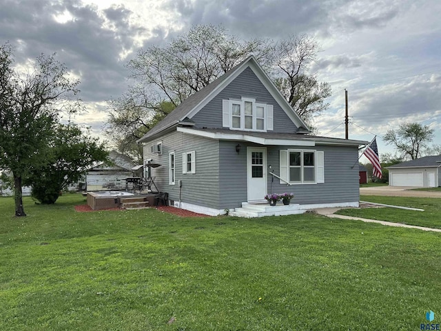 531 N Adams St, Salem, SD 57058 - rear view of house featuring a yard and central AC