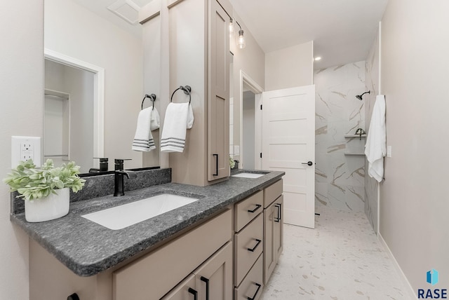 full bathroom featuring a marble finish shower and double vanity