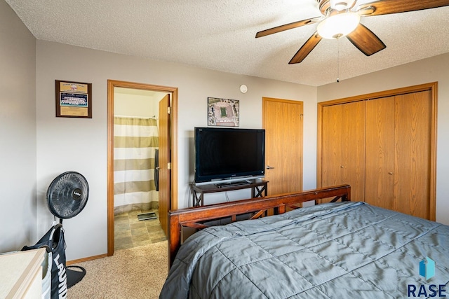 1805 S Sertoma Ave Unit 105, Sioux Falls, SD 57106 - carpeted bedroom featuring ensuite bathroom, ceiling fan, a textured ceiling, and baseboards