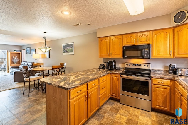 1805 S Sertoma Ave Unit 105, Sioux Falls, SD 57106 - kitchen featuring black microwave, stainless steel range with electric cooktop, a peninsula, a textured ceiling, and brown cabinetry